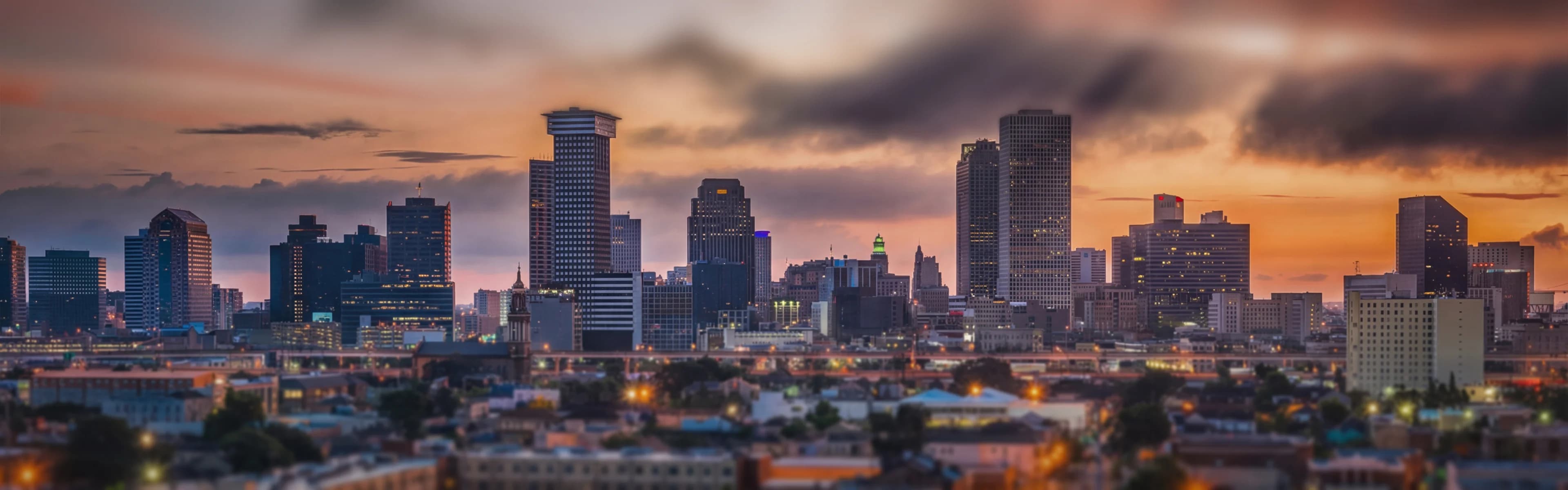 New Orleans skyline with riverfront buildings - managed Wi-Fi, fiber internet, and bulk TV services for New Orleans multifamily properties