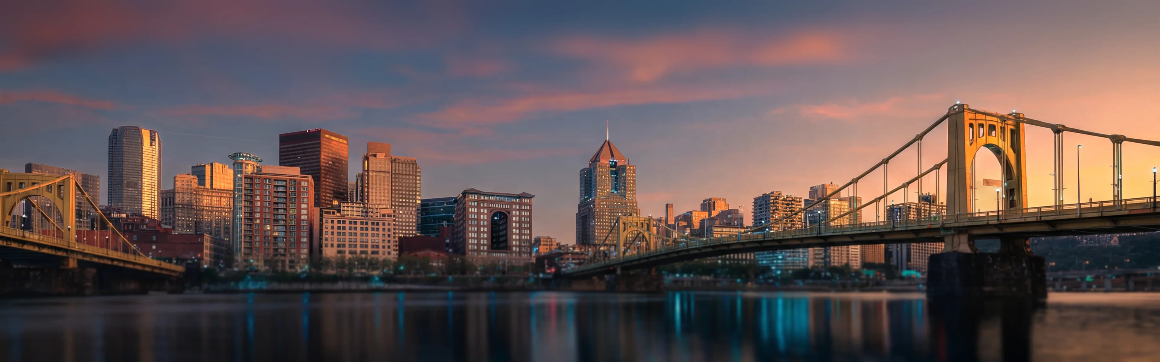 Pittsburgh skyline with river bridges - managed Wi-Fi, fiber internet, and bulk TV services for Pittsburgh multifamily properties